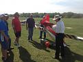 Soaring pilots give moral support as the tow pilot cleans his plane at the end of the day